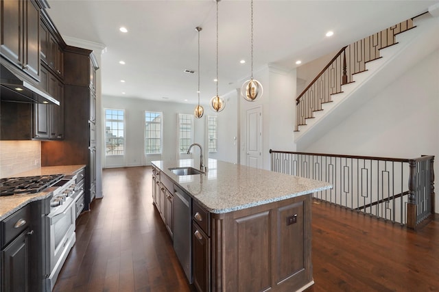 kitchen featuring a sink, appliances with stainless steel finishes, recessed lighting, dark wood-type flooring, and backsplash