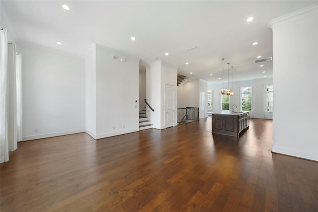 living area featuring visible vents, recessed lighting, and dark wood finished floors