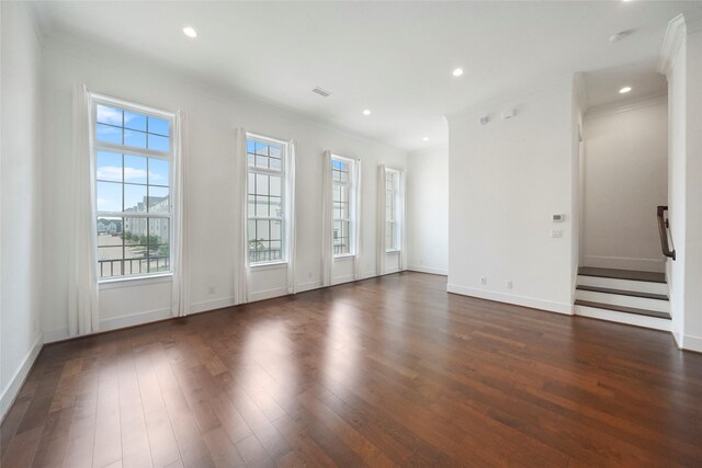 unfurnished living room featuring recessed lighting, dark wood-style flooring, baseboards, and visible vents