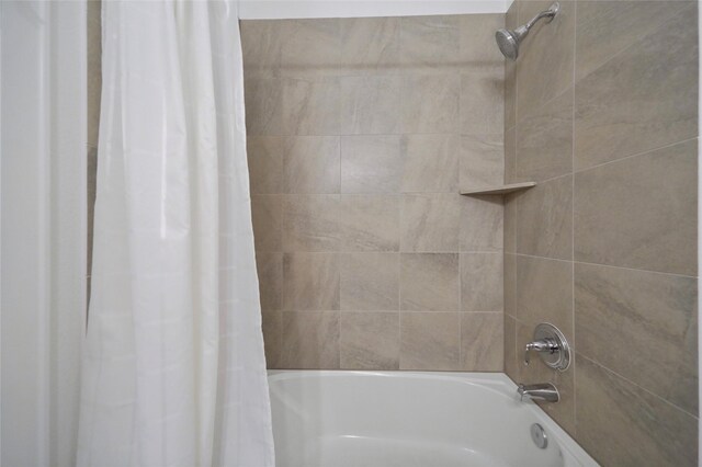 full bath featuring shower / tub combo with curtain