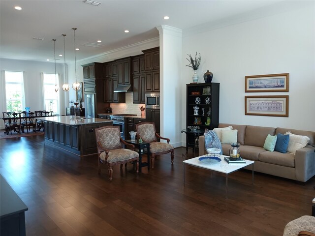 living room with crown molding, dark wood-style floors, recessed lighting, and visible vents