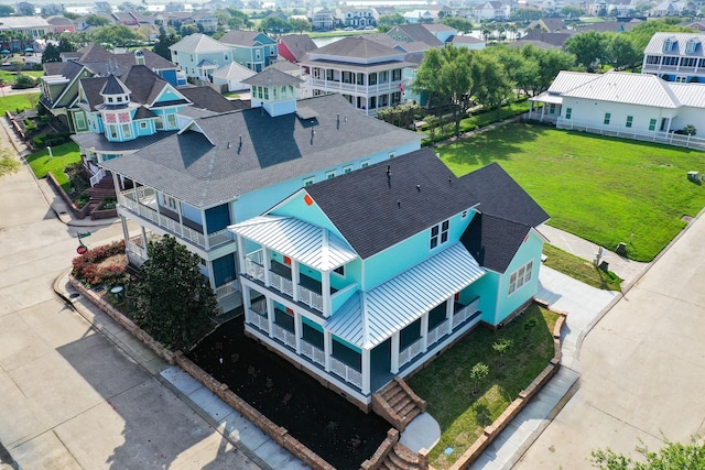 birds eye view of property with a residential view