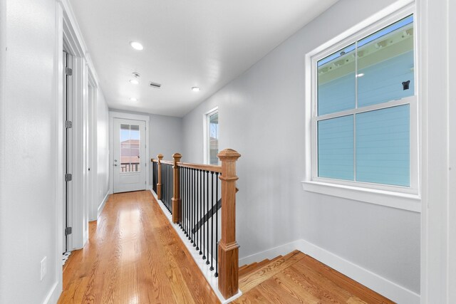 13 Caravelle Ct, Galveston, TX 77554 - corridor with an upstairs landing, light wood finished floors, and recessed lighting
