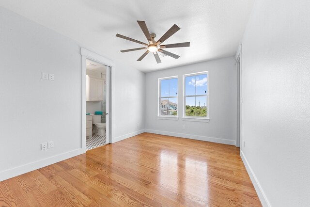 13 Caravelle Ct, Galveston, TX 77554 - empty room with a ceiling fan and light wood-style floors