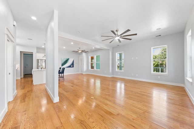 13 Caravelle Ct, Galveston, TX 77554 - unfurnished living room with a ceiling fan, light wood-style flooring, and recessed lighting