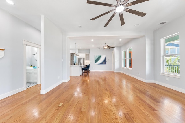 13 Caravelle Ct, Galveston, TX 77554 - unfurnished living room with ceiling fan, light wood-type flooring, and recessed lighting