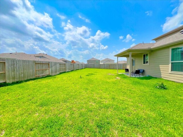 17014 Wild Stream Ct, Conroe, TX 77302 - view of yard with a patio and a fenced backyard