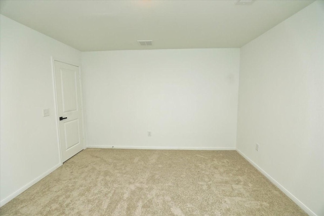 17014 Wild Stream Ct, Conroe, TX 77302 - empty room with visible vents, light colored carpet, and baseboards