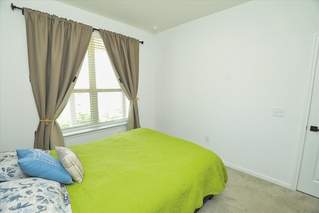 17014 Wild Stream Ct, Conroe, TX 77302 - bedroom with baseboards and light colored carpet