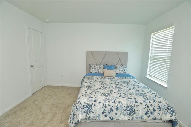17014 Wild Stream Ct, Conroe, TX 77302 - bedroom featuring baseboards, multiple windows, and carpet flooring