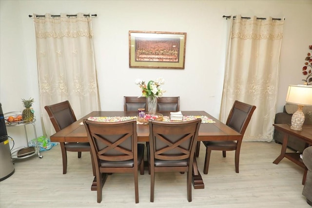 17014 Wild Stream Ct, Conroe, TX 77302 - dining space featuring light wood-style flooring