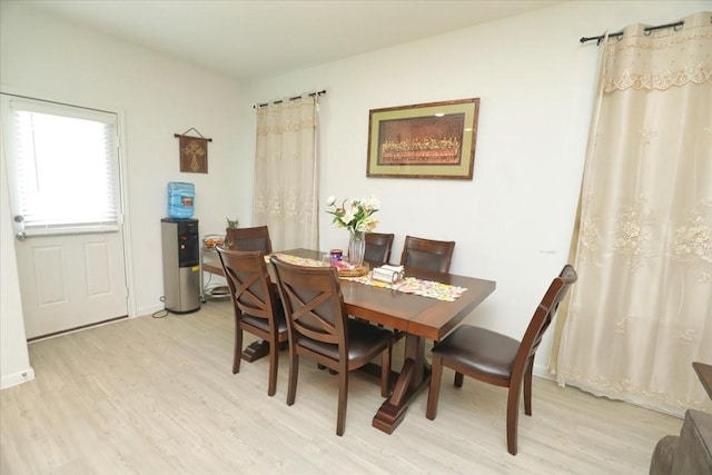 17014 Wild Stream Ct, Conroe, TX 77302 - dining space with light wood-type flooring and baseboards