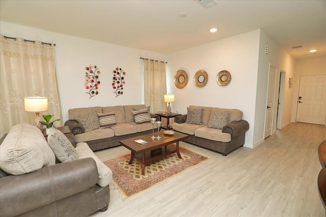 17014 Wild Stream Ct, Conroe, TX 77302 - living room featuring visible vents, recessed lighting, light wood-style flooring, and baseboards