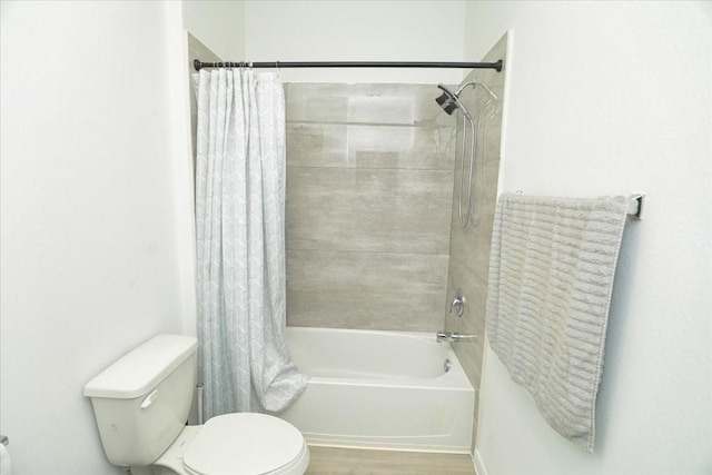 17014 Wild Stream Ct, Conroe, TX 77302 - bathroom with shower / tub combo, wood finished floors, and toilet