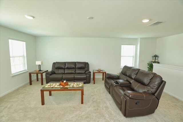 17014 Wild Stream Ct, Conroe, TX 77302 - living area with baseboards, visible vents, and light colored carpet