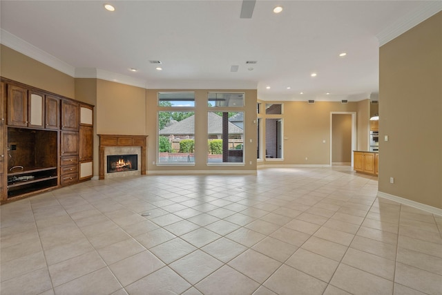 8802 Kennet Valley Rd, Spring, TX 77379 - unfurnished living room with ornamental molding, light tile patterned flooring, a fireplace, recessed lighting, and baseboards