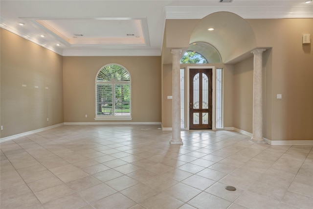 8802 Kennet Valley Rd, Spring, TX 77379 - entrance foyer featuring ornate columns, crown molding, light tile patterned floors, baseboards, and a raised ceiling