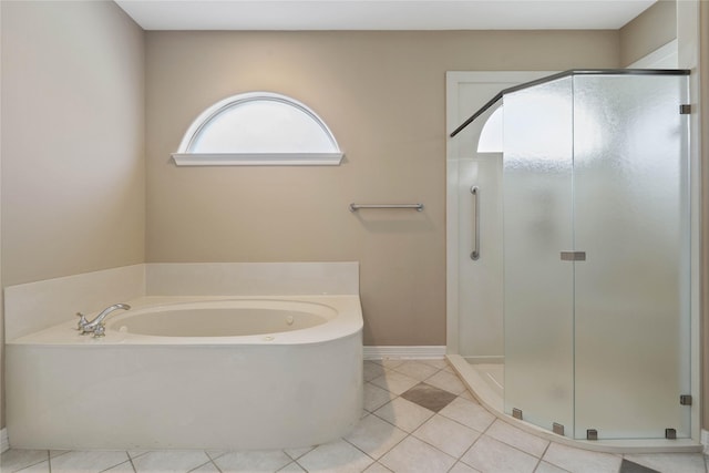 8802 Kennet Valley Rd, Spring, TX 77379 - bathroom with a stall shower, a bath, tile patterned flooring, and baseboards