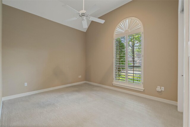 8802 Kennet Valley Rd, Spring, TX 77379 - empty room with carpet floors, vaulted ceiling, a ceiling fan, and baseboards