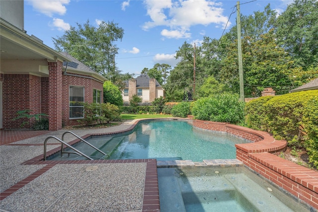 8802 Kennet Valley Rd, Spring, TX 77379 - view of swimming pool featuring a pool with connected hot tub and a patio area