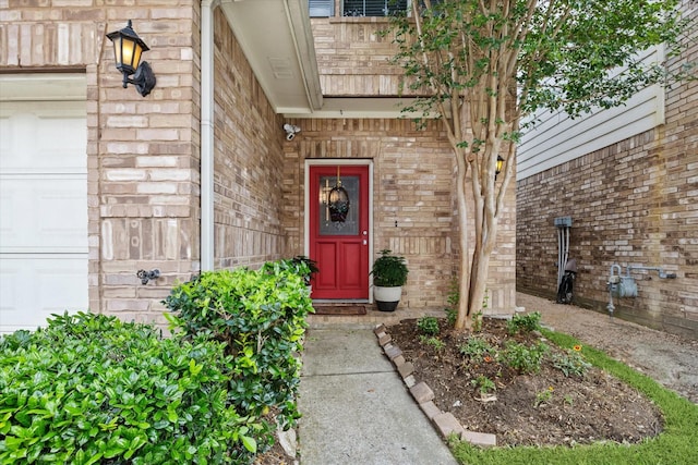 doorway to property with brick siding