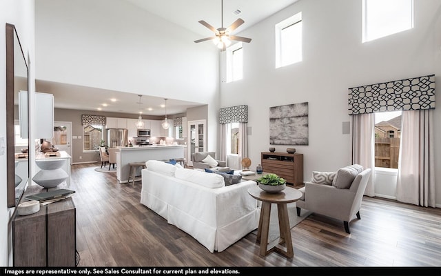 511 French Lavender Ln, Crosby, TX 77532 - living area featuring dark wood-style flooring, visible vents, and ceiling fan