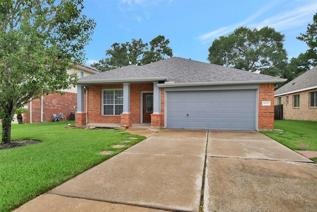 ranch-style house featuring brick siding, an attached garage, a front yard, and roof with shingles