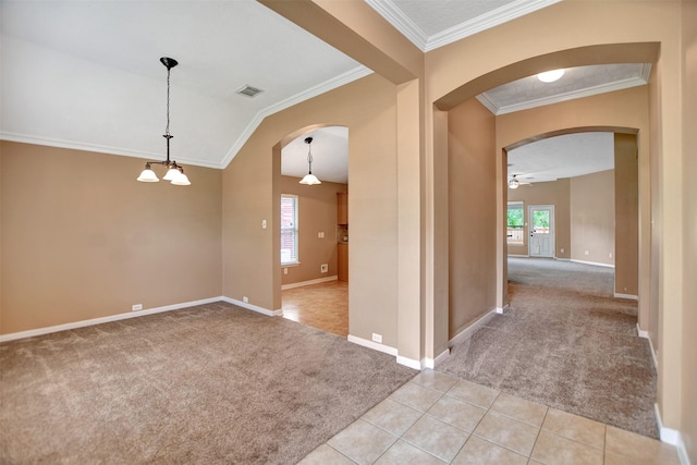 unfurnished room with light colored carpet, arched walkways, a ceiling fan, and visible vents