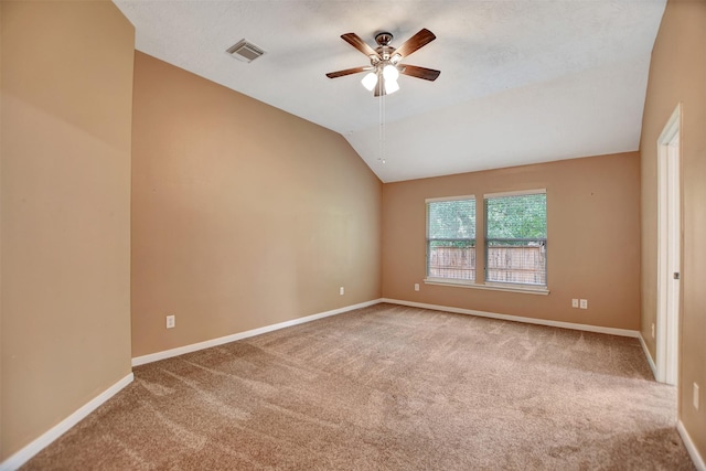 unfurnished room featuring carpet floors, ceiling fan, and visible vents
