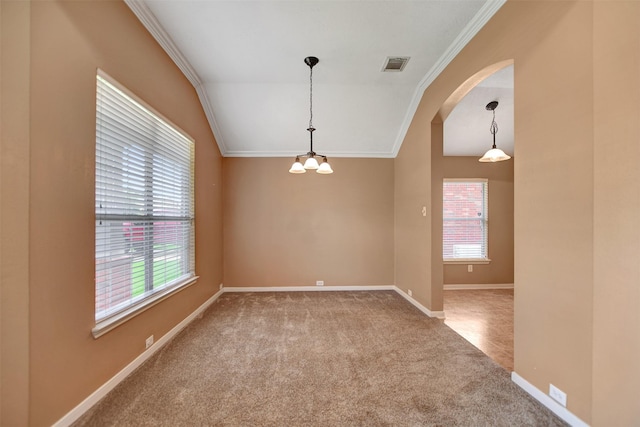spare room with crown molding, arched walkways, carpet flooring, and visible vents