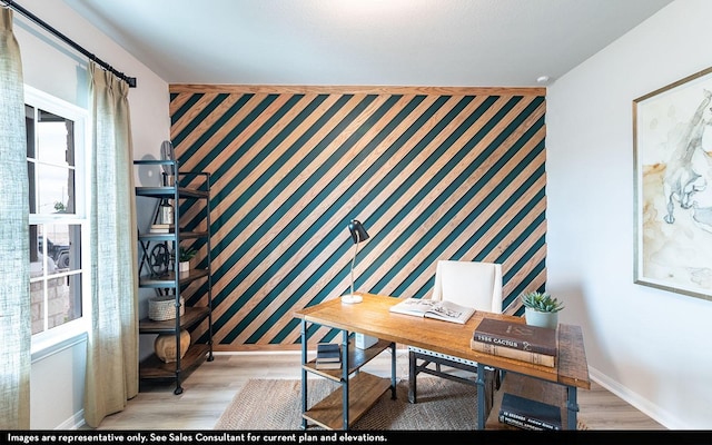 507 Sacred Fig Ln, Crosby, TX 77532 - office featuring an accent wall, baseboards, light wood-style floors, and wallpapered walls