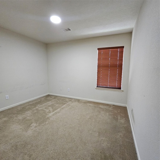 11727 Madison Oak St, Houston, TX 77038 - carpeted empty room with visible vents and baseboards