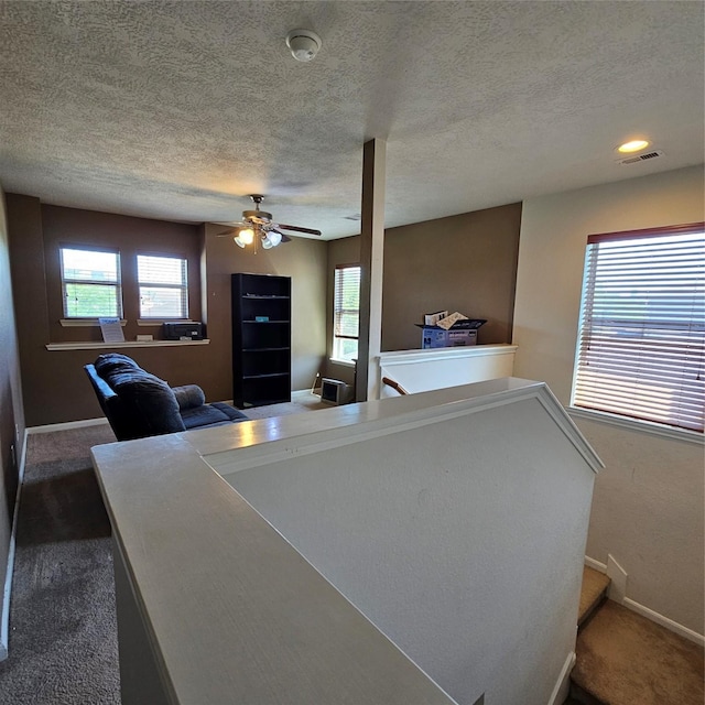 11727 Madison Oak St, Houston, TX 77038 - interior space featuring visible vents, a ceiling fan, carpet floors, and a healthy amount of sunlight