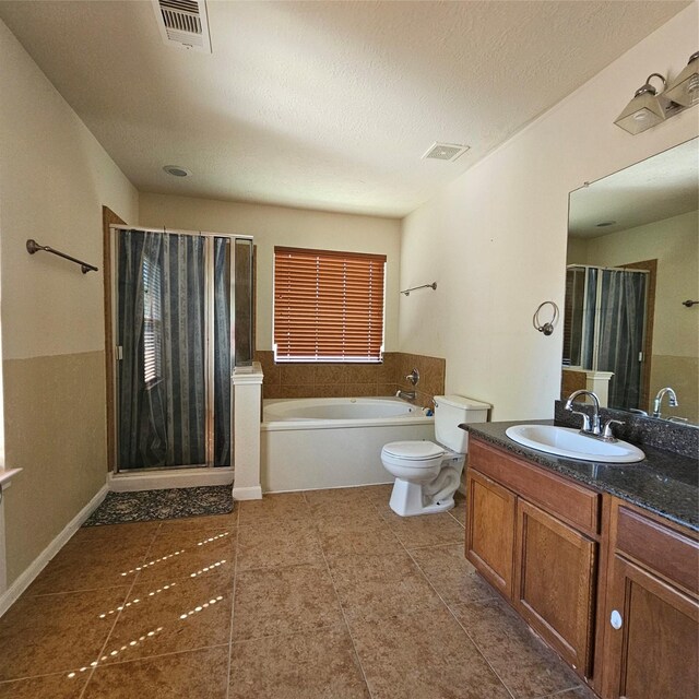 11727 Madison Oak St, Houston, TX 77038 - full bath with a textured ceiling, a garden tub, vanity, and visible vents