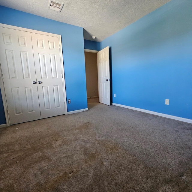 11727 Madison Oak St, Houston, TX 77038 - unfurnished bedroom with visible vents, baseboards, carpet flooring, and a closet
