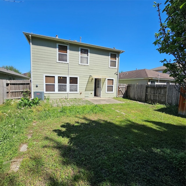 11727 Madison Oak St, Houston, TX 77038 - back of house with a patio area, a fenced backyard, cooling unit, and a lawn