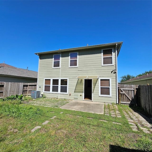 11727 Madison Oak St, Houston, TX 77038 - back of house with a yard, a patio area, a fenced backyard, and central AC unit