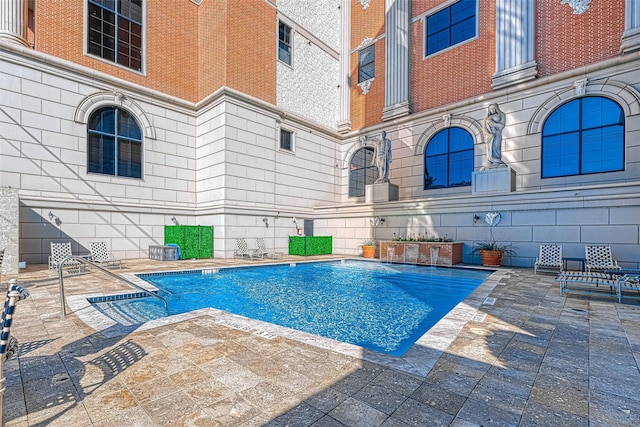 pool featuring a patio