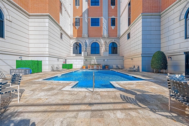 community pool featuring a patio