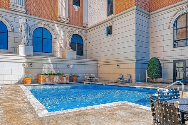 pool featuring a patio area