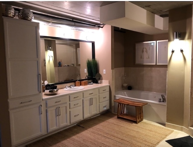 full bath featuring vanity and a bath