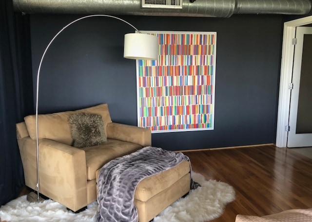 sitting room featuring wood finished floors