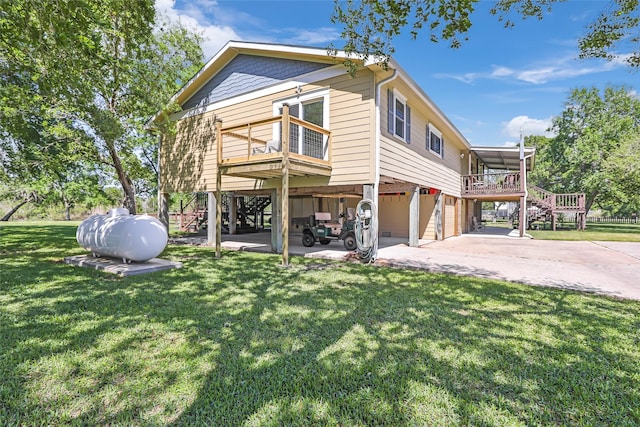 603 Shady Glen Dr, Anahuac, TX 77514 - view of side of home with a garage, stairway, a yard, driveway, and a deck