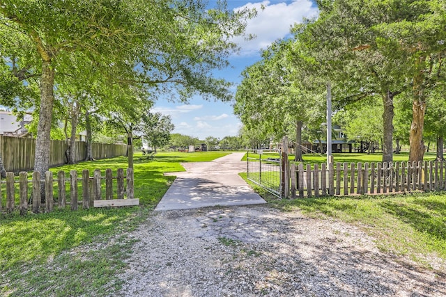 603 Shady Glen Dr, Anahuac, TX 77514 - view of road with a gated entry