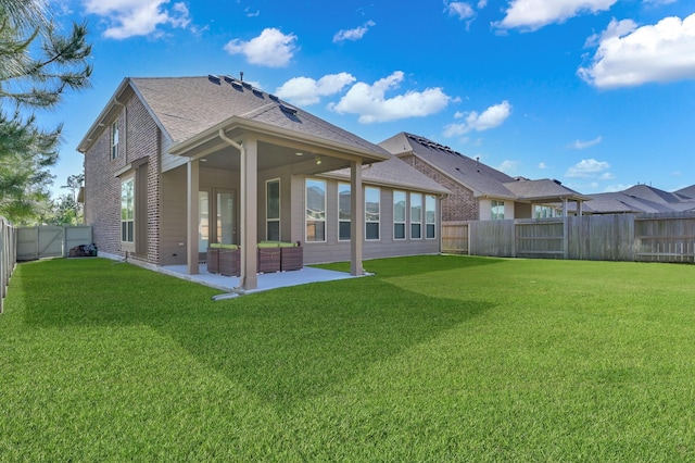 17052 Easter Lily Dr, Conroe, TX 77385 - back of house featuring a patio and roof with shingles