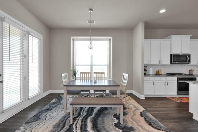 17052 Easter Lily Dr, Conroe, TX 77385 - dining space featuring dark wood-style flooring, baseboards, and recessed lighting