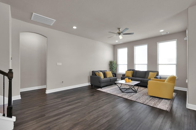 17052 Easter Lily Dr, Conroe, TX 77385 - living room with ceiling fan, recessed lighting, baseboards, dark wood finished floors, and arched walkways