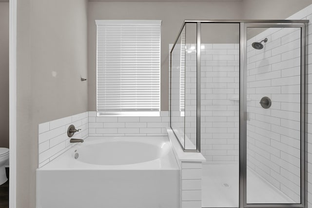 17052 Easter Lily Dr, Conroe, TX 77385 - full bathroom featuring a shower stall and a garden tub