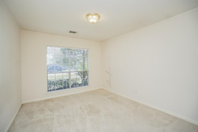 23006 Greenrush Dr, Katy, TX 77494 - unfurnished room featuring visible vents, baseboards, and light colored carpet