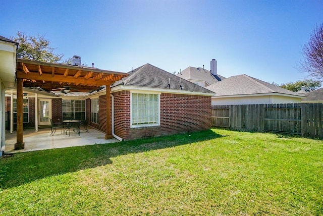 23006 Greenrush Dr, Katy, TX 77494 - back of house featuring a yard, a fenced backyard, a ceiling fan, and a patio area